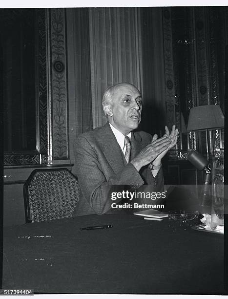 The expressive hands of India's Prime Minister, Pandit Jawaharlal, Nehru, accentuate his meaning. He was holding a press conference in New York in...