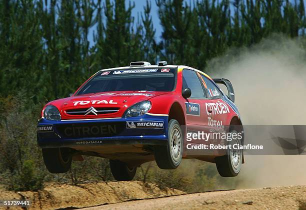 Sebastien Loeb of Finland and co driver Daniel Elena of Monte Carlo and the Citroen Xsara WRC Team on their way to winning the Rally Australia during...