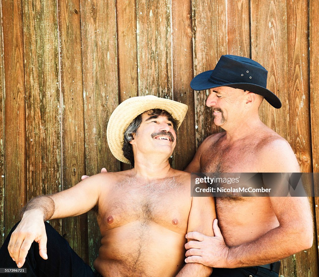 Gay mature bear hairy couple smiling at each other