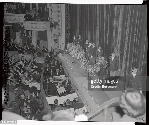 For the opening Judy Garland put on a terrific show, and was one stage for a solid hour. Here, a line of ushers brings up the numerous floral...