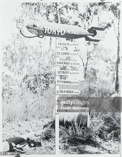 "Here we come to Tokyo." A sign somewhere in New Guinea leaves no doubt about the sentiments of the builders.