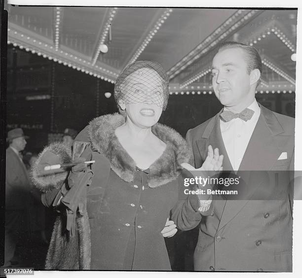 Another performer who brought back memories, but who had also made a very successful comeback is Gloria Swanson as shown here with her escort Brandon...