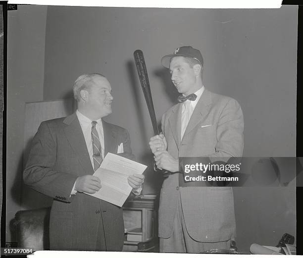 New York Giant's President Horace Stoneham holds the contract after Bobby Thomson, , centerfielder, signed with the Giants for the 1951 season, at...