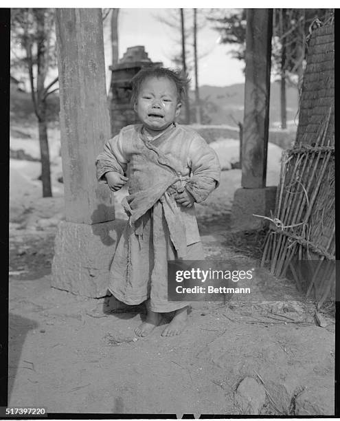 South Korea: Spokesman For Sorrow. A tiny Korean waif voices the grief of countless thousands of civilians as he pours out his heart in tears near...