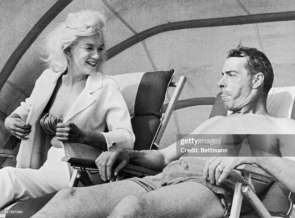 Marilyn Monroe and Joe DiMaggio on the Beach