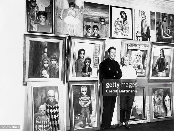 Partners in art as well as matrimony, Margaret and Walter Keane show off the paintings they'll take from their native San Francisco, Calif., to...