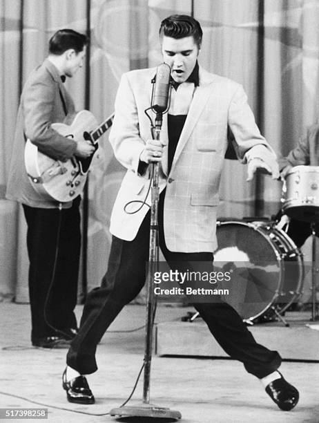 Singer Elvis Presley performing Hillbilly Heartbreak on stage in Hollywood, California.