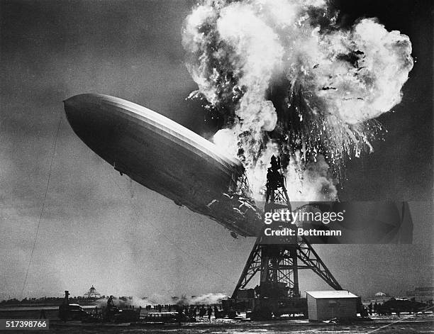 The airship Hindenburg explodes into a huge ball of fire as it comes in for a landing at Lakehurst, New Jersey. Miraculously, many of the passengers...