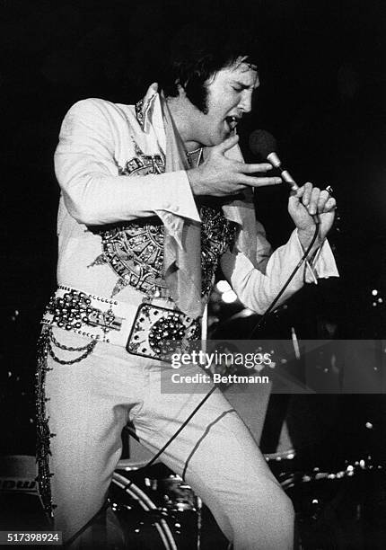 Lincoln, NE- Elvis Presley, the King of Rock and Roll, belts out a song during a performance, here 6/20. Elvis died 8/16 in Memphis at the age of 42...