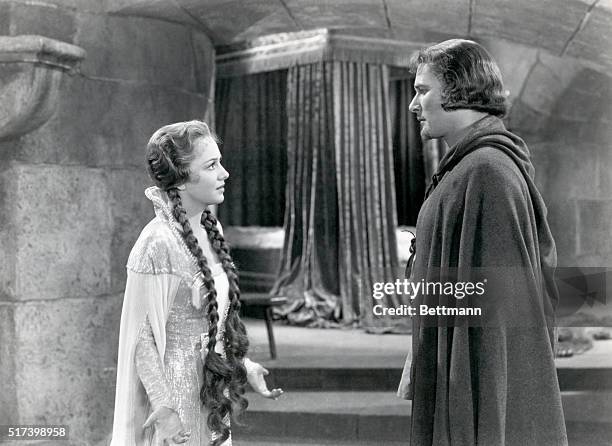 Picture shows a movie scene from, "The Adventures of Robin Hood", starring Olivia DeHavilland and Errol Flynn.