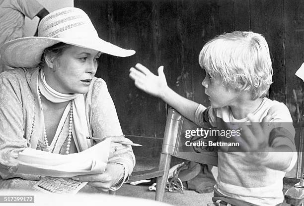 Hialeah, FL- Film newcomer, Ricky Schroder seems to have all the lines in this scene with actress, Faye Dunaway. They're relaxing during a break in...