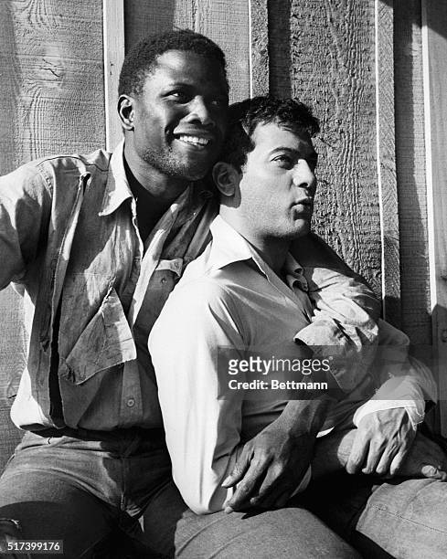Kernville, California- Actors Sidney Poitier and Tony Curtis have become close friends during the filming of "The Defiant Ones," a United Artists...