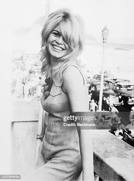 Rio De Janeiro, Brazil- French actress, Brigitte Bardot, stops traffic and pedestrians in the street below, January 10th., as she relaxes on a...