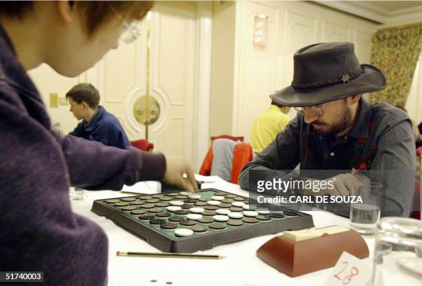 British competitor Ben Pridmore studies his score sheet as his opponent makes his move in the World Othello Championships, at Selfridges Hotel,...