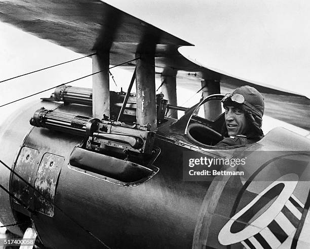 World War I fighter pilot Eddie Rickenbacker, known as the "ace of aces", sits in his Spad XIII fighter plane.