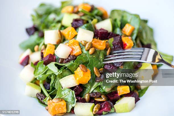 Roasted Vegetable Salad - arugula, spinach, butternut squash, beets, granny smith apples, raisins, pumpkin seeds and roasted garlic vinaigrette at...