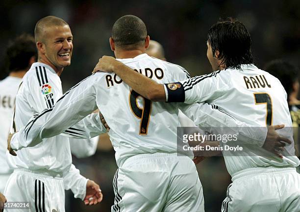 Real Madrid's Brazilian player Ronaldo celebrates with England?s David Beckham, left, and Raul Gonzalez after scoring a goal in a Primera Liga soccer...