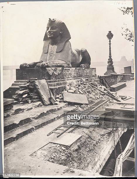 The statue of the Sphinx, on London's Thames Embankment, after a World War II zeppelin attack. | Located in: Cleopatra's Needle, London.