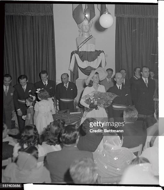 Actress Rita Hayworth smiles radiantly after her marriage to Prince Ali Khan at a simple ceremony in Vallauris Town Hall, May 27. Between the Bridal...