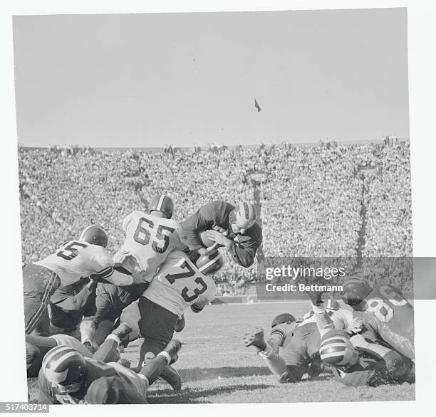 "If at First You Don't' Succeed." Ann Arbor, Michigan: Wisconsin tacklers John Simcic and Jerome Smith (73( plough into Michigan's line smashing...