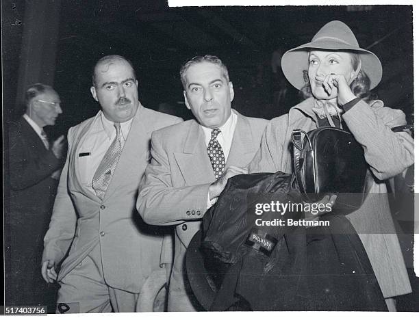 Returning home from France where she was making a film is actress Greta Garbo. She arrived in New York on the French liner Ile de France, October...
