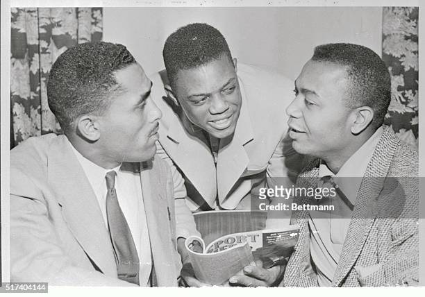 Accompanied by Suitcase Simpson, and Larry Doby, , of the Cleveland Indians, prize rookie Willie Mays of the New York Giants, appears in Atlanta, on...