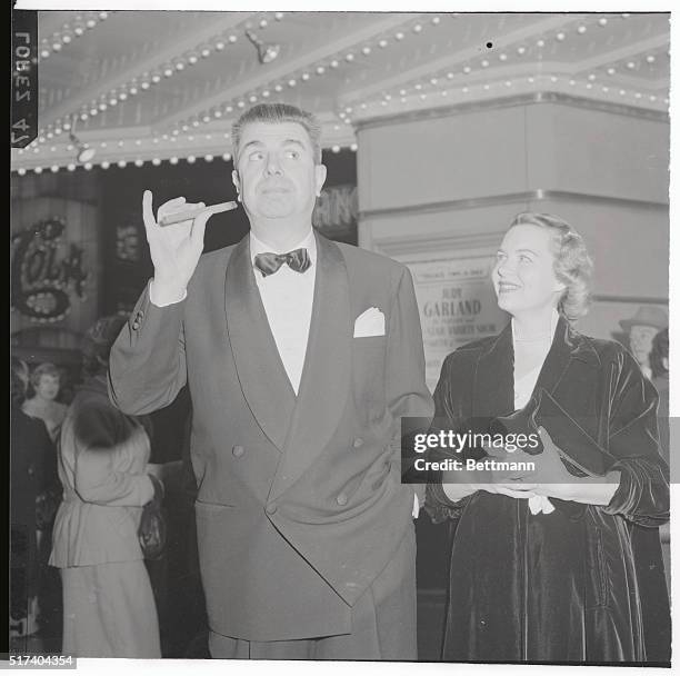 The missus looks amused as Ken Murray does tricks with his cigar. Ken's type of entertainment would be ideally suited for Vaudeville.