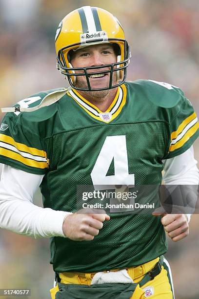 Brett Favre of the Green Bay Packers is all smiles after completing a touchdown pass against the Minnesota Vikings during a game at Lambeau Field on...
