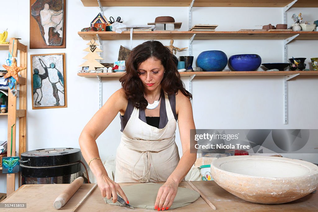 Ceramicist working in her studio