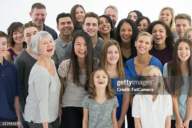 multi-generational family standing together - happy smiling people multi generations stock pictures, royalty-free photos & images