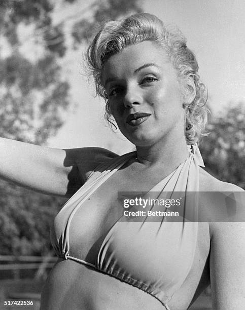 Hollywood film star Marilyn Monroe relaxes on her terrace, looking beautifully content. Actor Hugh Marlowe told the voluptuous actress that she...