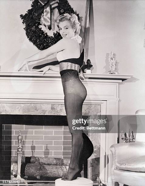 Hollywood, CA- Hollywood's lucious Marilyn Monroe shows what a really well fitted Christmas stocking should look like. The shapely actress was...