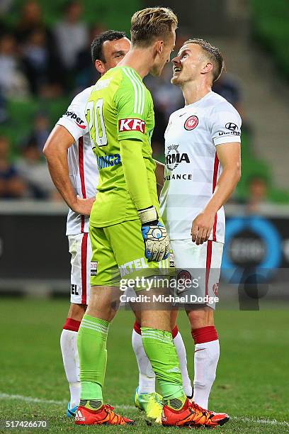 Scott Jamieson of the Wanderers stands toe to toe with Victory goalkeeper Lawrence Thomas during the round 25 A-League match between the Melbourne...
