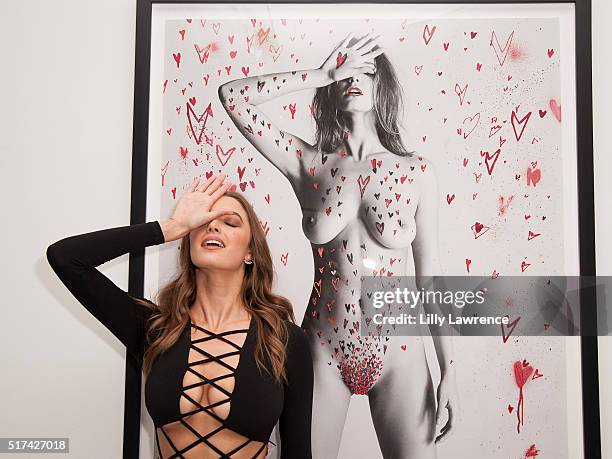 Model Alyssa Arce poses with a piece she modeled for at 8 Loves A Solo Exhibition from Steve Shaw Photos and Contemporary Artist Gregory Siff at...