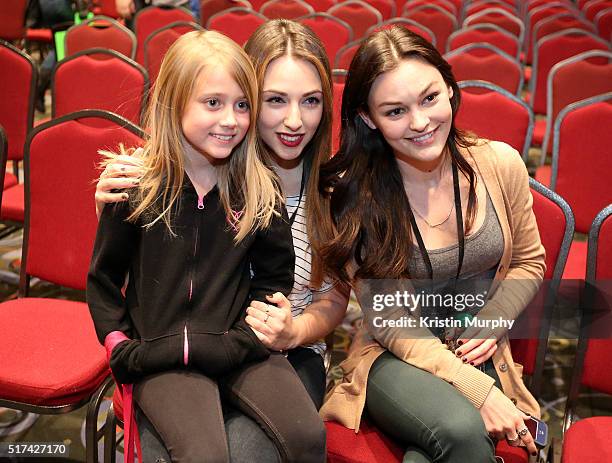Nicola Posener and Melanie Stone pose for a photo with a young fan after the Mythica Salt Lake Comic Con FANX 2016 Panel on March 24, 2016 at the...