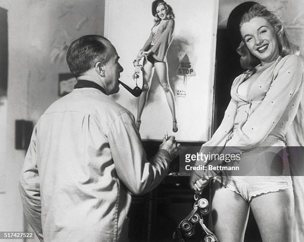 Young Marilyn Monroe poses for painter Earl Moran, for a picture in a calender.