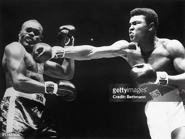Boxer Cassius Clay punching the head of Doug Jones in the first round of their heavyweight contenders' fight at Madison Square Garden on March 13,...