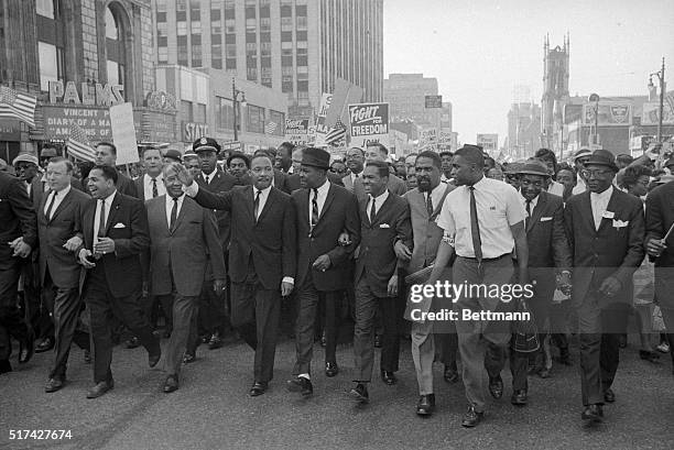 Detroit, MI-ORIGINAL CAPTION READS: Reverend Martin Luther King Jr. Leads parade through downtown Detroit.