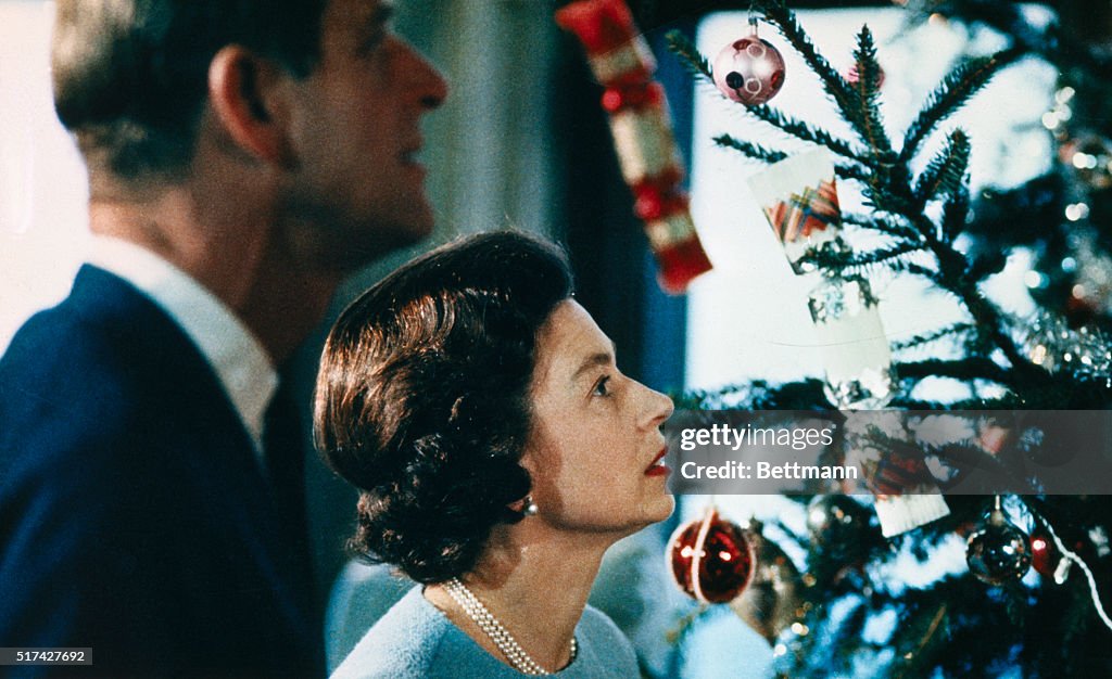 Queen Elizabeth and Prince Philip Looking at Christmas Tree