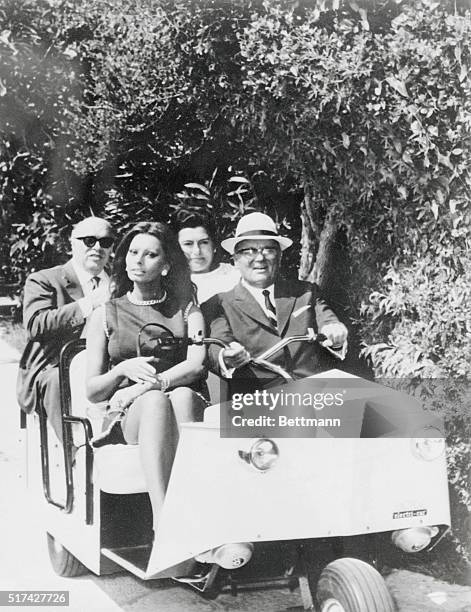 Across the Adriatic. Brioni, Yugoslavia: Josip Broz Tito, president of Yugoslavia gives actress Sophia Loren and her husband, film producer Carlo...