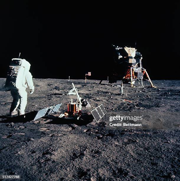 Tranquility Base, The Moon: Astronaut Buzz Aldrin, lunar module pilot, is photographed during the Apollo 11 extra vehicular activity on the moon....