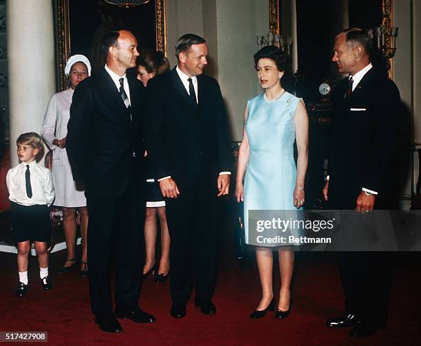 Queen Elizabeth II receives Apollo 11 astronauts : Michael Collins, Neil Armstrong, and Buzz Aldrin at Buckingham Palace as part of their world tour....