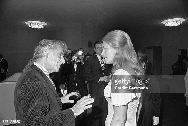 Washington: Composer Leonard Bernstein who composed "Mass" for the opening of the John F. Kennedy Center for the Performing Arts, chats with Joan...