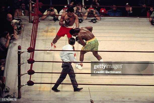 Muhammad Ali lands a right to the head of heavyweight champion Joe Frazier during their title bout at Madison Square Garden. Frazier became the...