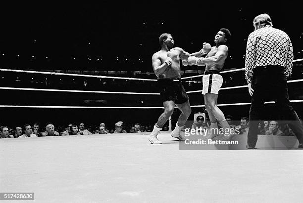 Muhammad Ali takes a hard right to the head in the 10th round from Buster Mathis in heavyweight bout in the Astrodome. Ali took a 12 round decision.