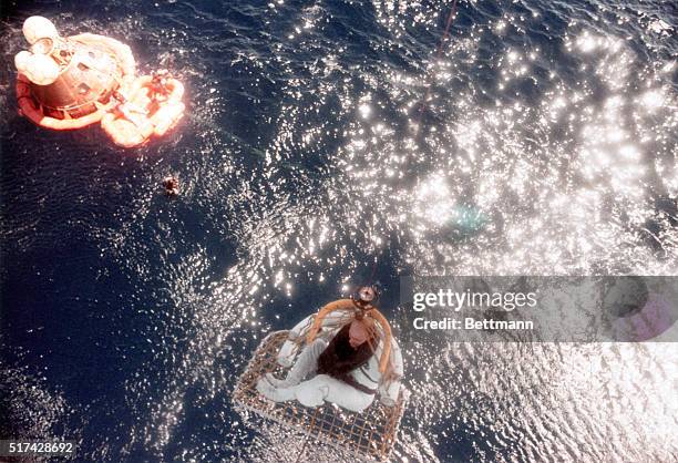 Apollo 16 Pacific Recovery Area: Apollo 16 command module pilot Thomas K. Mattingly II is hoisted aboard a helicopter during recovery operations in...