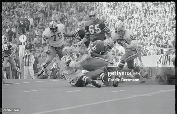 Dallas: San Francisco quarterback John Brodie is sacked and dropped for a 6-yard-loss in second quarter by Dallas' Bob Lilly . Others in picture are...