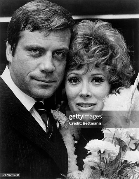 Hollywood glamour girl Jill St. John smiles for camera together with her movie husband, Oliver Reed. Jill is playing the very thankless role of an...