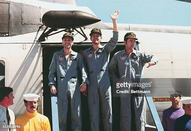Apollo 16 Pacific Recovery Area: Waving to well-wishers, Apollo 16 astronauts, l-r, John W. Young, Charles M. Duke, Jr., and Thomas K. Mattingly II...