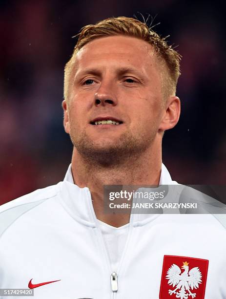 Poland's Kamil Glik poses for a team picture ahead the international friendly football match against Serbia on March 23, 2016 in Poznan.